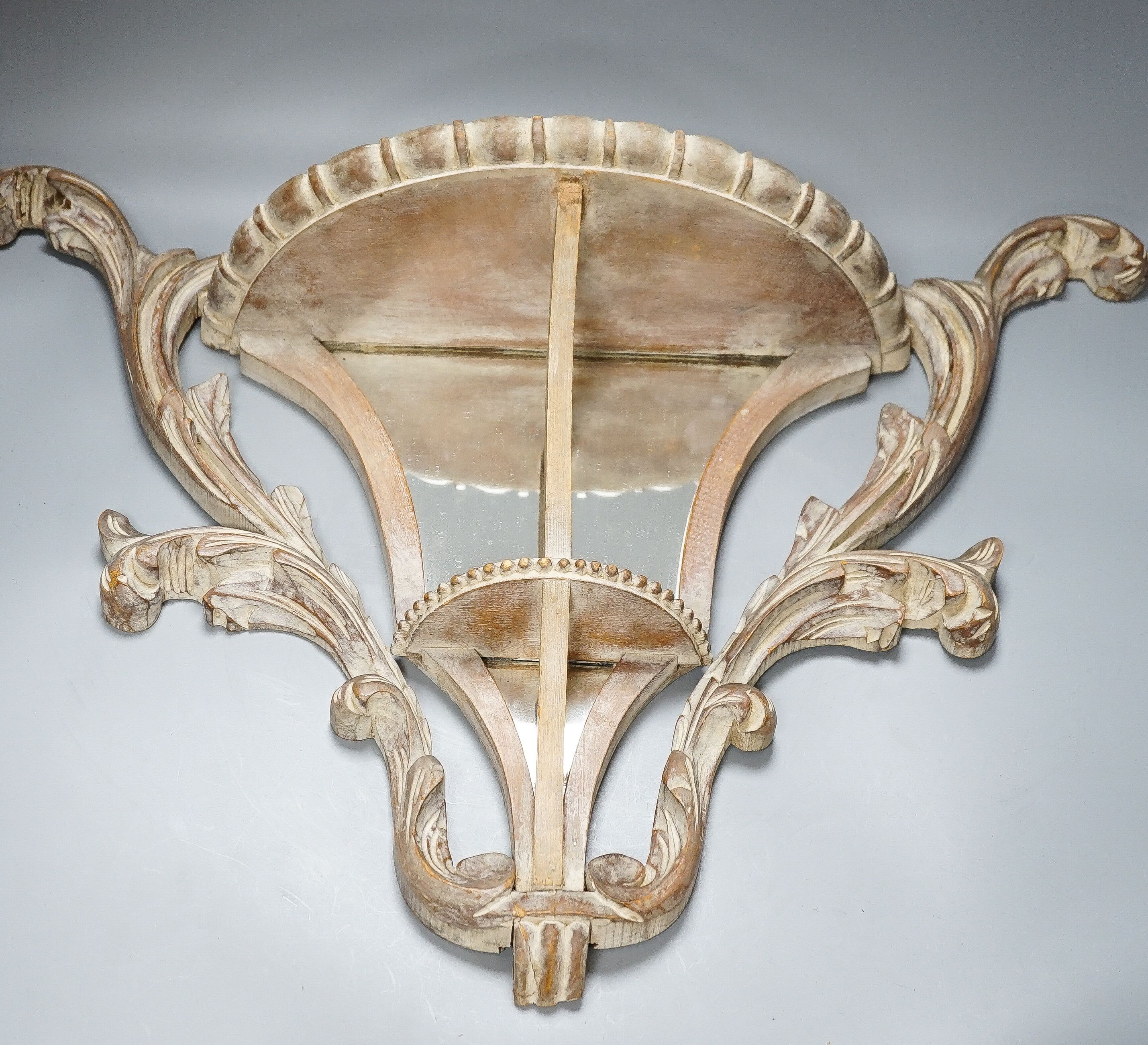 A pair of early 20th century mirror backed carved beech wall brackets 50cm